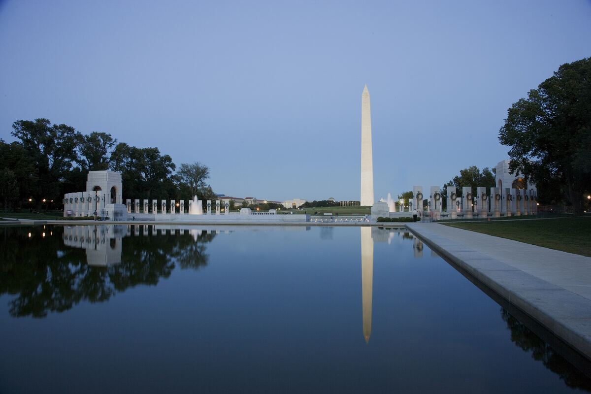 The Washington Monument reflected in still water